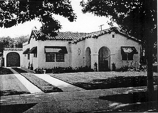 a good use of awnings and a ribbon driveway.